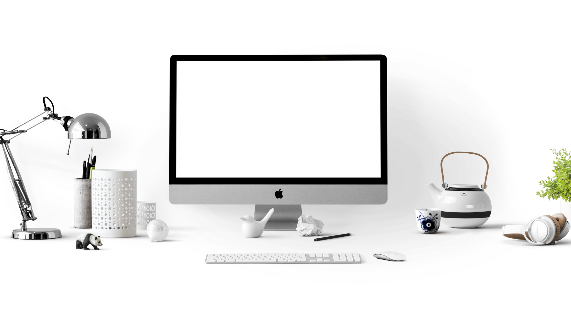Photo of a computer on a minimal white desk