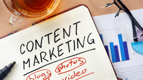 Image of notebook with content marketing written on it