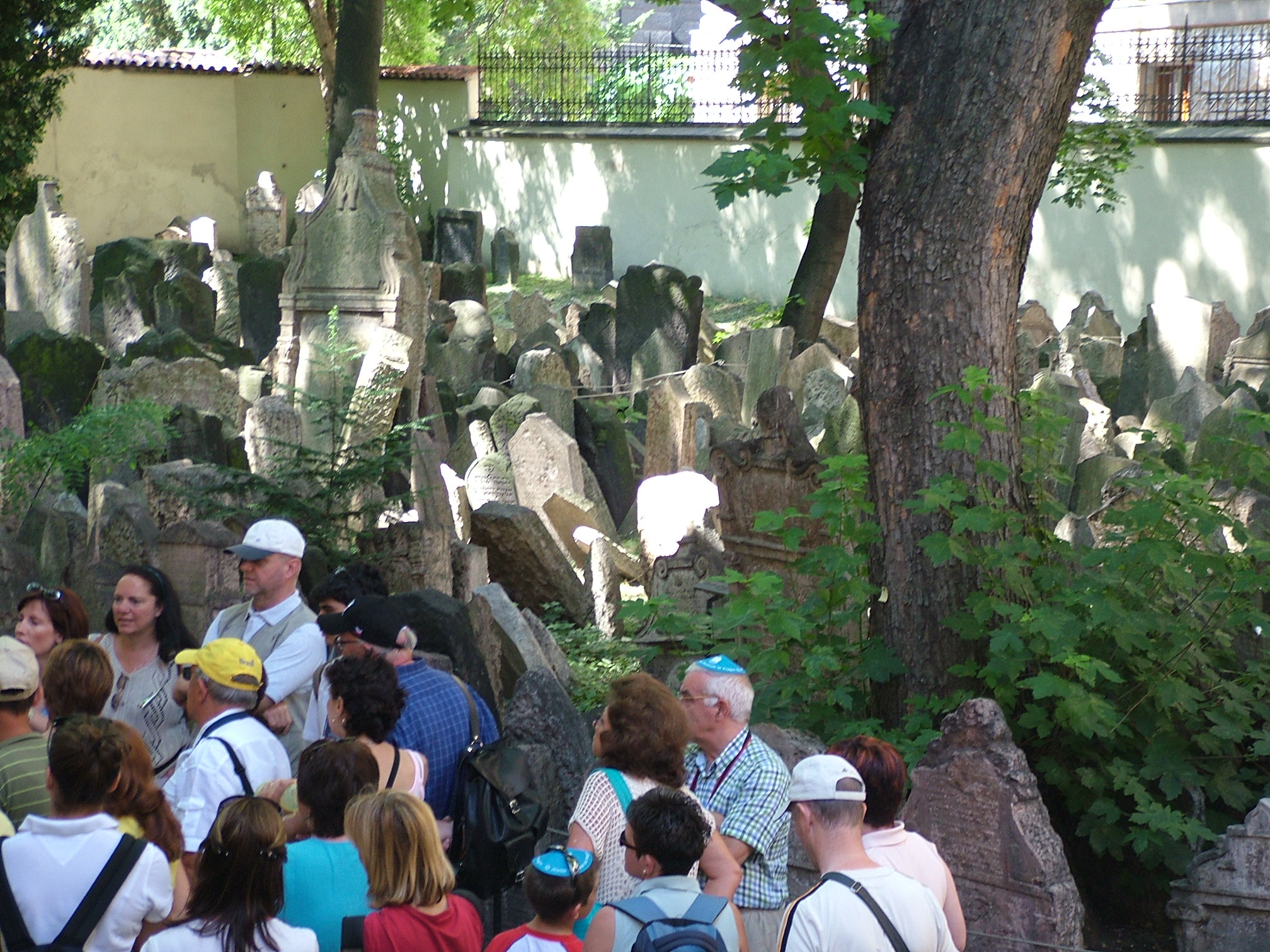 Photo of group of tourists in a graveyard